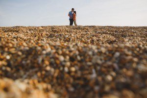 engagement photo on chesil beach in dorset