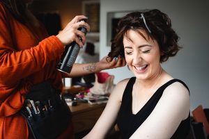 A woman with short brown hair smiles