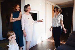 Four females stand indoors