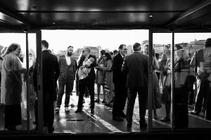 A group of people dressed formally gather