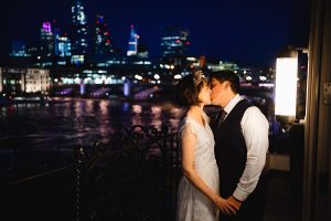 A bride and groom share a kiss