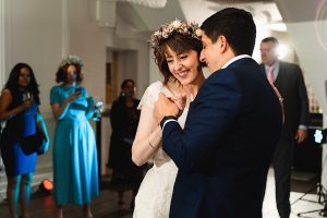 A bride and groom smile